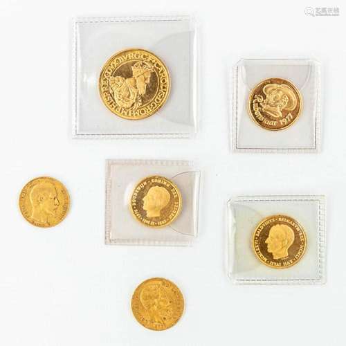 A collection of 6 coins made of gold.