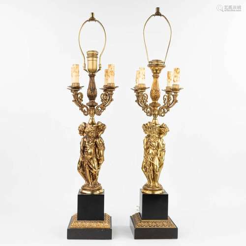 A pair of table lamps in the shape of the three graces made ...