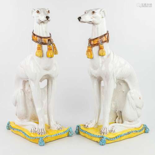 A pair of 2 mid-century greyhounds made of glazed terracotta...