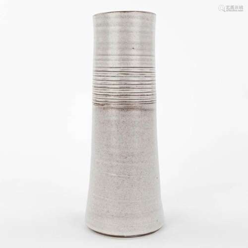 A mid-century vase made of white-glazed ceramics and marked ...