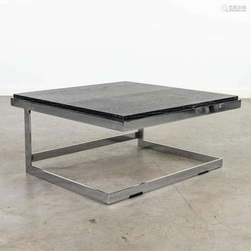 A mid-century coffee table with a reversible top, made of ch...