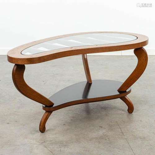 A mid-century coffee table made of wood and glass.