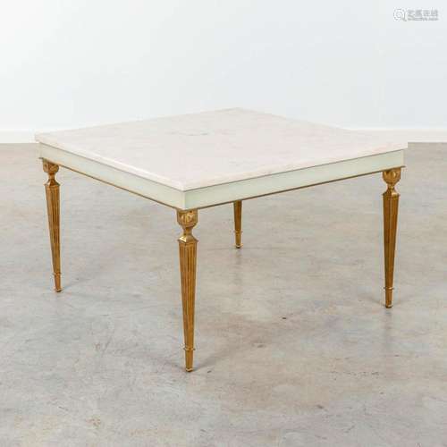 A coffee table made in Hollywood Regency style, brass and ma...