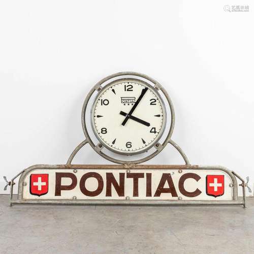 A vintage advertising sign made by Pontiac with a working cl...