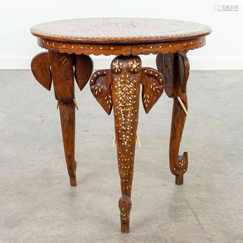 An Anglo-Indian coffee table made of hardwood and decorated ...