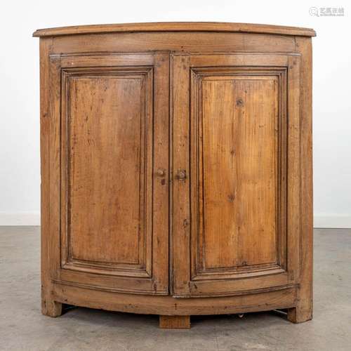 An antique stripped corner cabinet made of oak, 19th century...