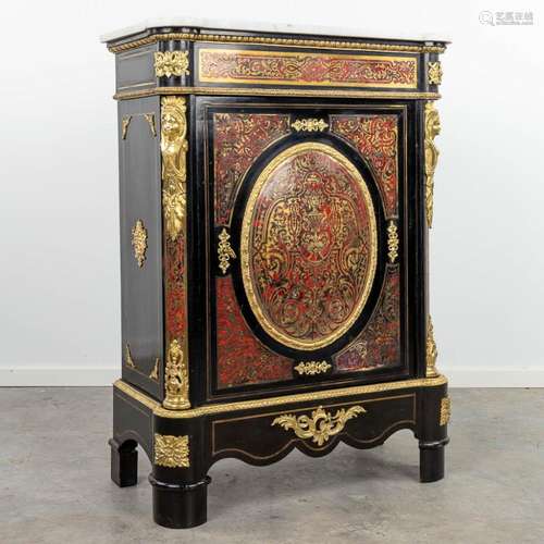 A single door cabinet finished with boulle tortoise shell in...