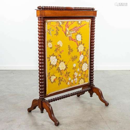 A fireplace screen with flower decor in a Louis Philippe sty...