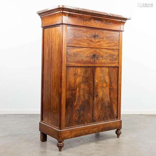 A linen cabinet made in Louis Philippe style and finished wi...