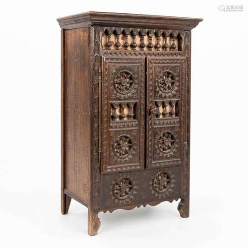 A miniature Breton cabinet, made of sculptured wood. (H:37cm...