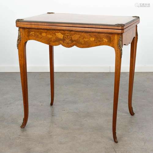 A game table finished with marquetry inlay in Louis XV style...