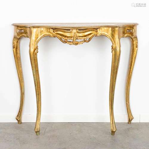 A gilt console table made of wood with stucco. (H:86cm)