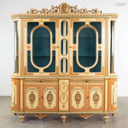 A display cabinet made of patinated wood in Italian style. (...