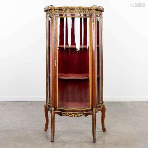 A display cabinet with curved glass, in Louis XVI style. (H:...