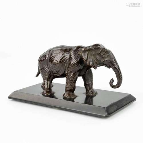 A statue of an elephant, made of patinated bronze and mounte...