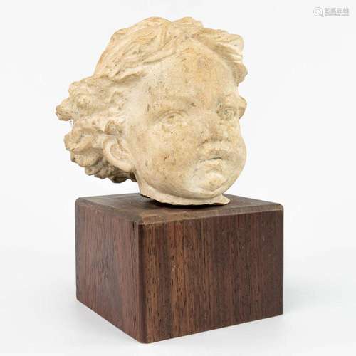 A head of a child made of terracotta. (H:14cm)