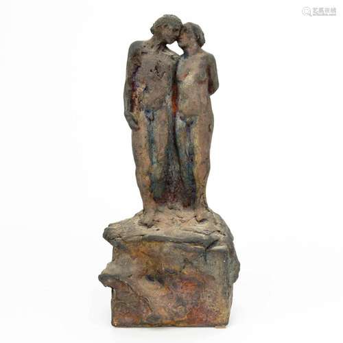 A terracotta statue of a naked couple, with initials F. D. (...