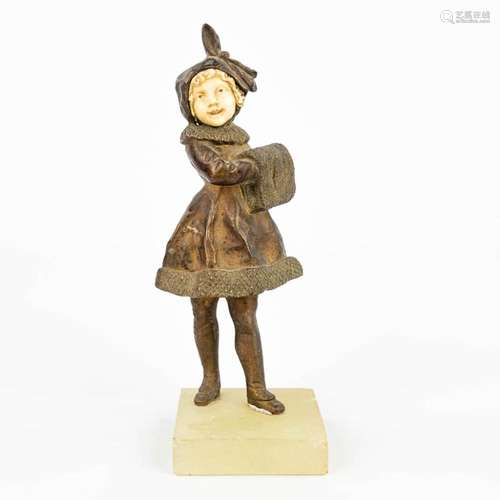 A statue of a lady chryselephantine and made in art deco sty...