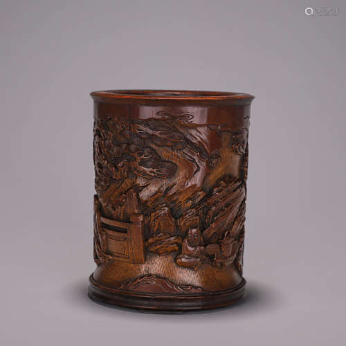 A figure carved bamboo brush pot