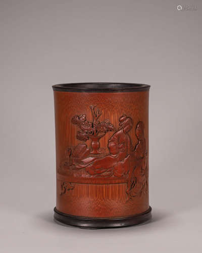 A figure carved bamboo brush pot