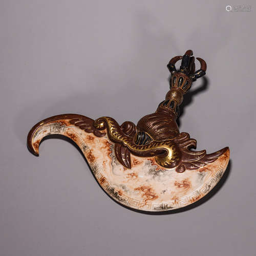 A glazed porcelain dragon head talisman