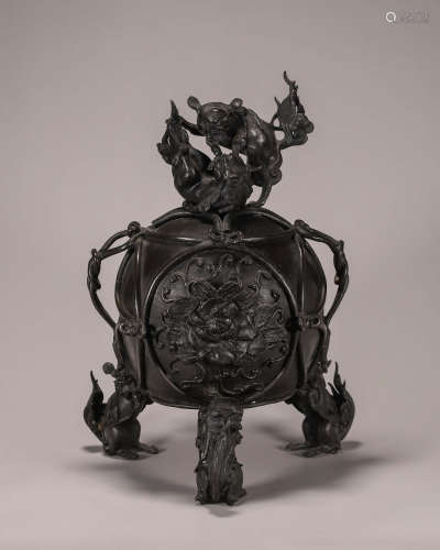 A three-legged copper incense burner