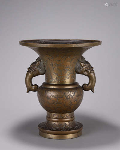 A copper vase with dragon-shaped ears