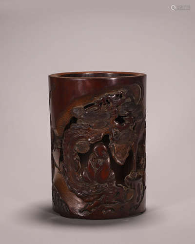 A hollowed out arhat bamboo brush pot