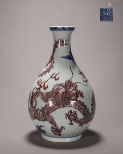 A blue and white underglaze red dragon and phoenix porcelain...