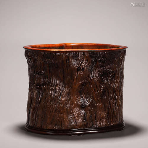 A wooden brush pot