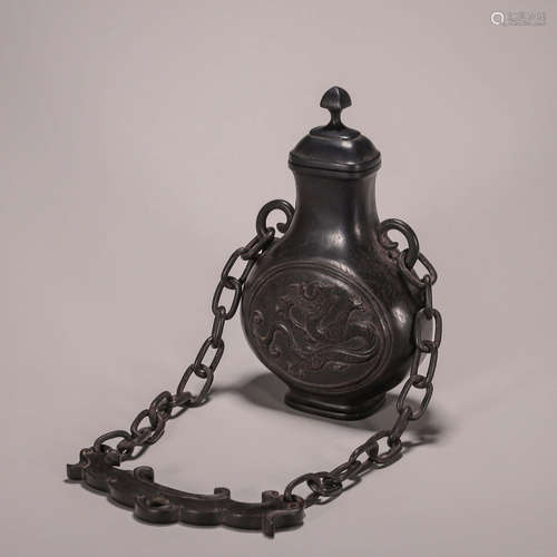 A dragon patterned red sandalwood hanging bottle