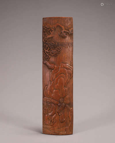 A carved bamboo arm rest