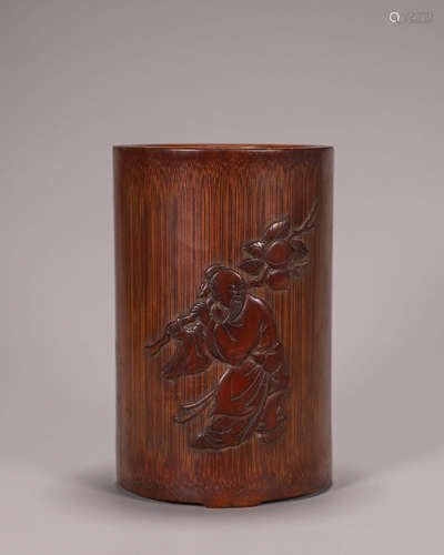 A figure carved bamboo brush pot