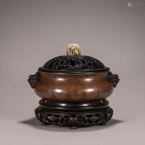 A copper censer with lion head-shaped ears