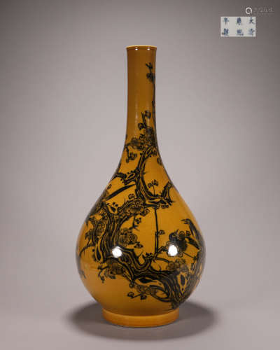 A yellow glazed ink colored magpie and plum blossom porcelai...