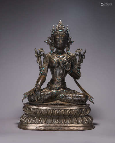 A copper white tara buddha statue