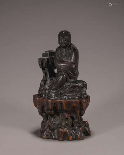 An aloeswood reading figurine