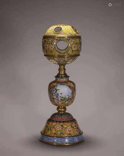 A figure copper enamel candlestick