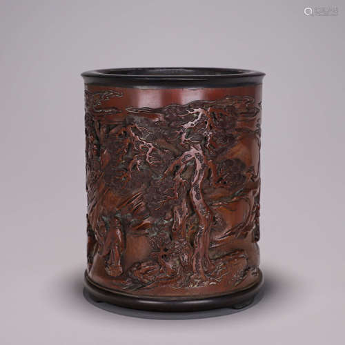 A carved bamboo brush pot