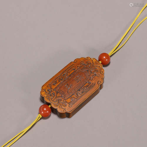 An inscribed bamboo pendant