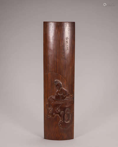 A figure carved bamboo arm rest