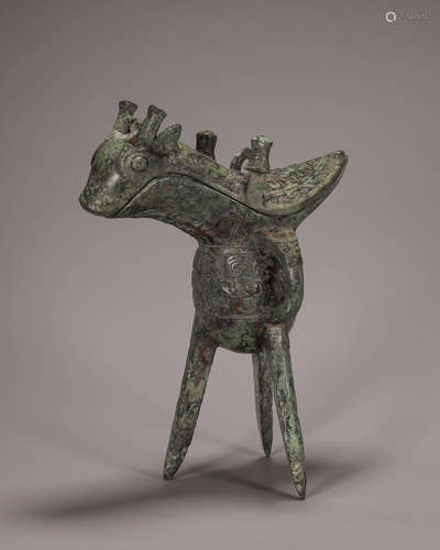 A bronze goat head jue cup