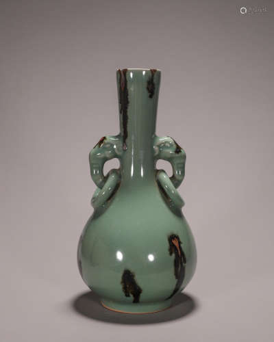 A Longquan kiln porcelain vase with elephant head-shaped ear...