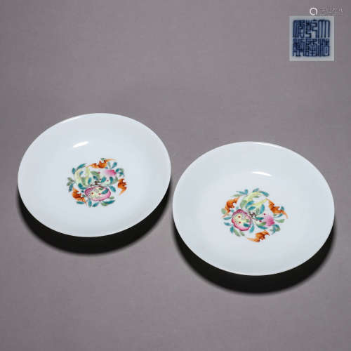 A pair of famille rose flower and butterfly porcelain plates