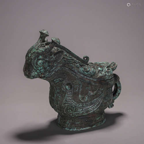 A phoenix bird patterned bronze goat head pot