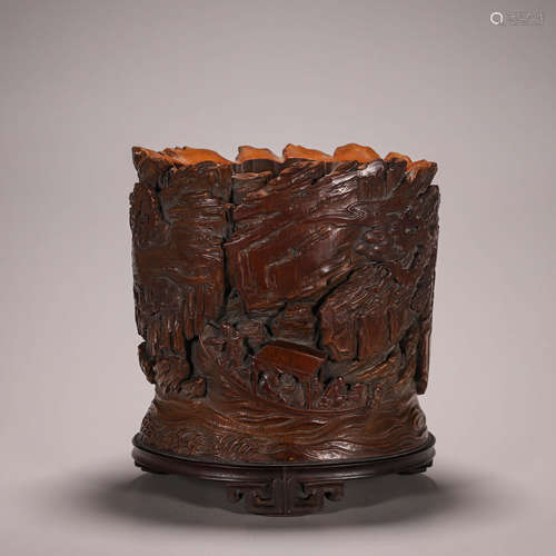 A carved bamboo brush pot