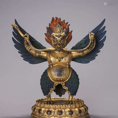 A copper Garuda statue