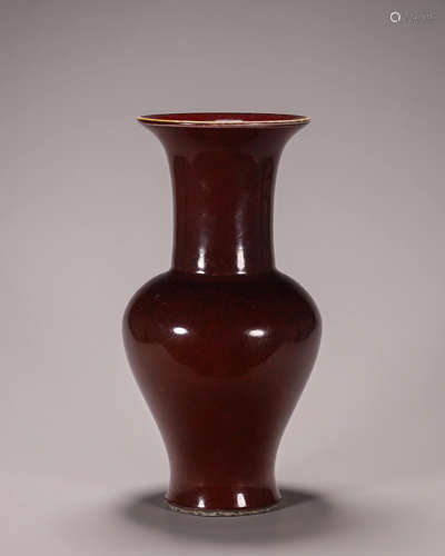 A red glazed porcelain vase