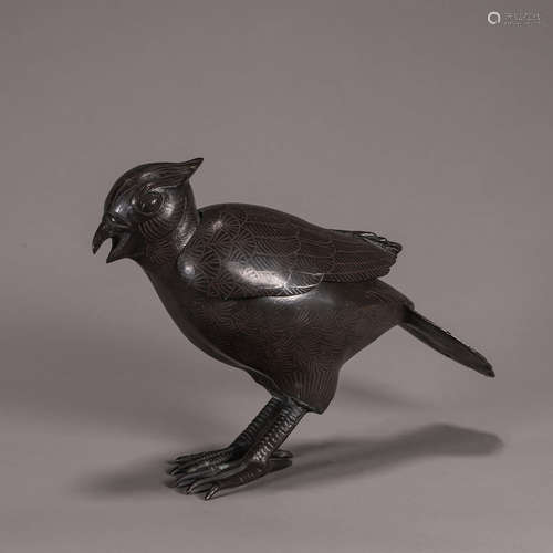 A copper bird incense burner