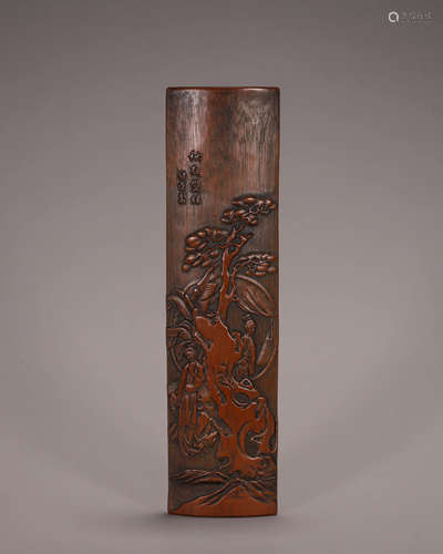 A carved bamboo arm rest